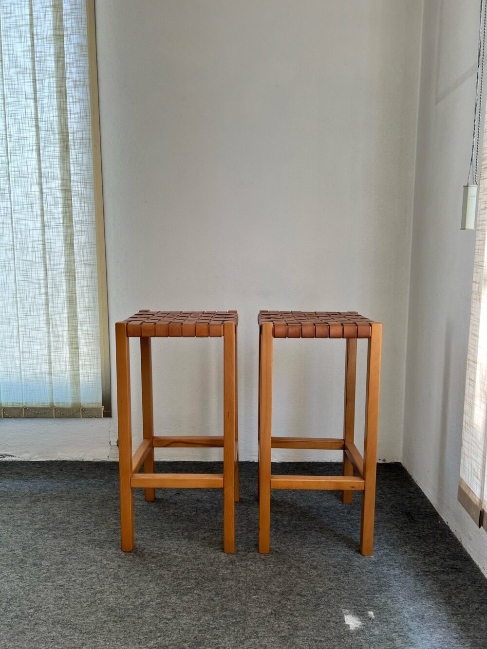 Pair of high stools in wood and woven leather